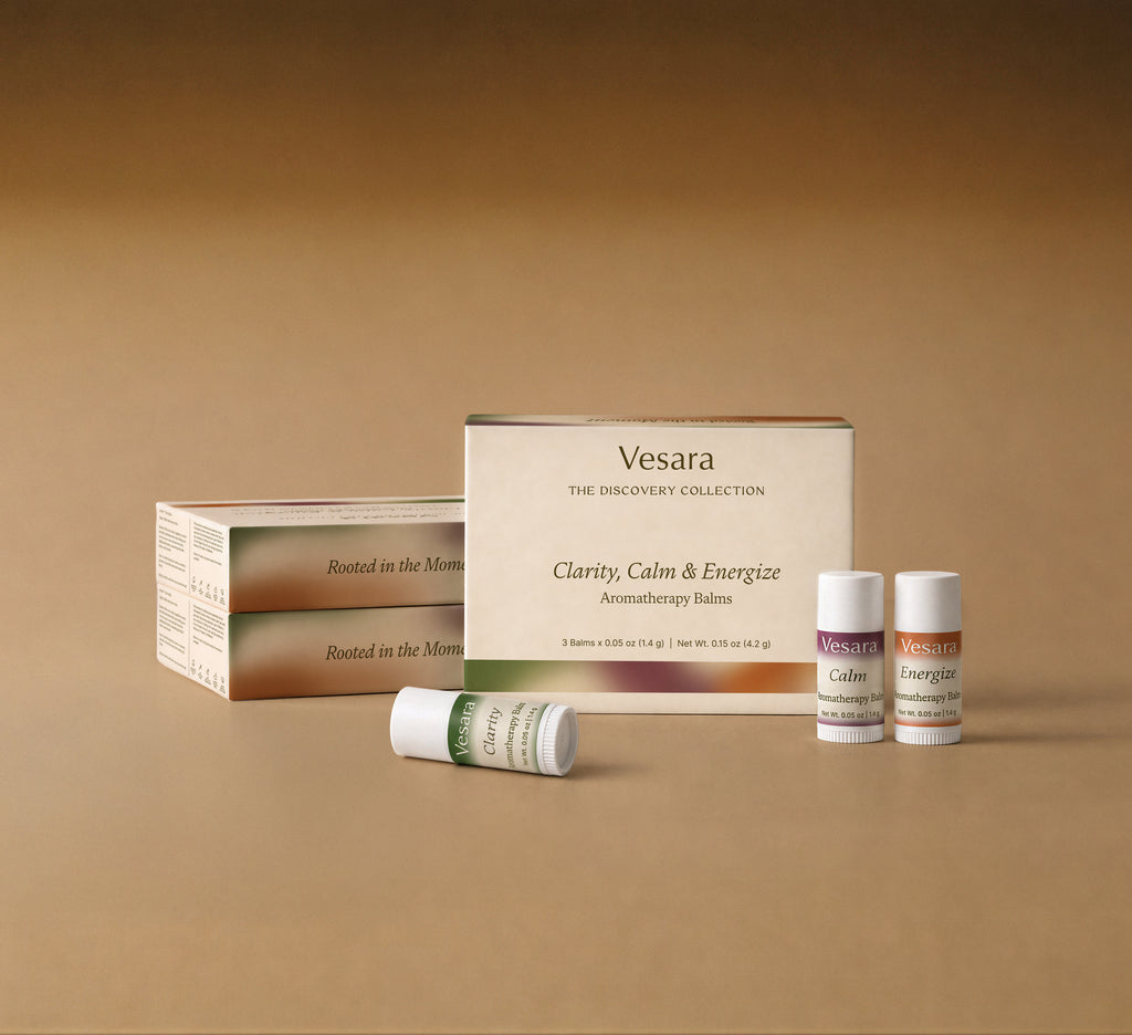 Vesara Discovery Collection gift box with Clarity, Calm, and Energize aromatherapy balms on warm beige background